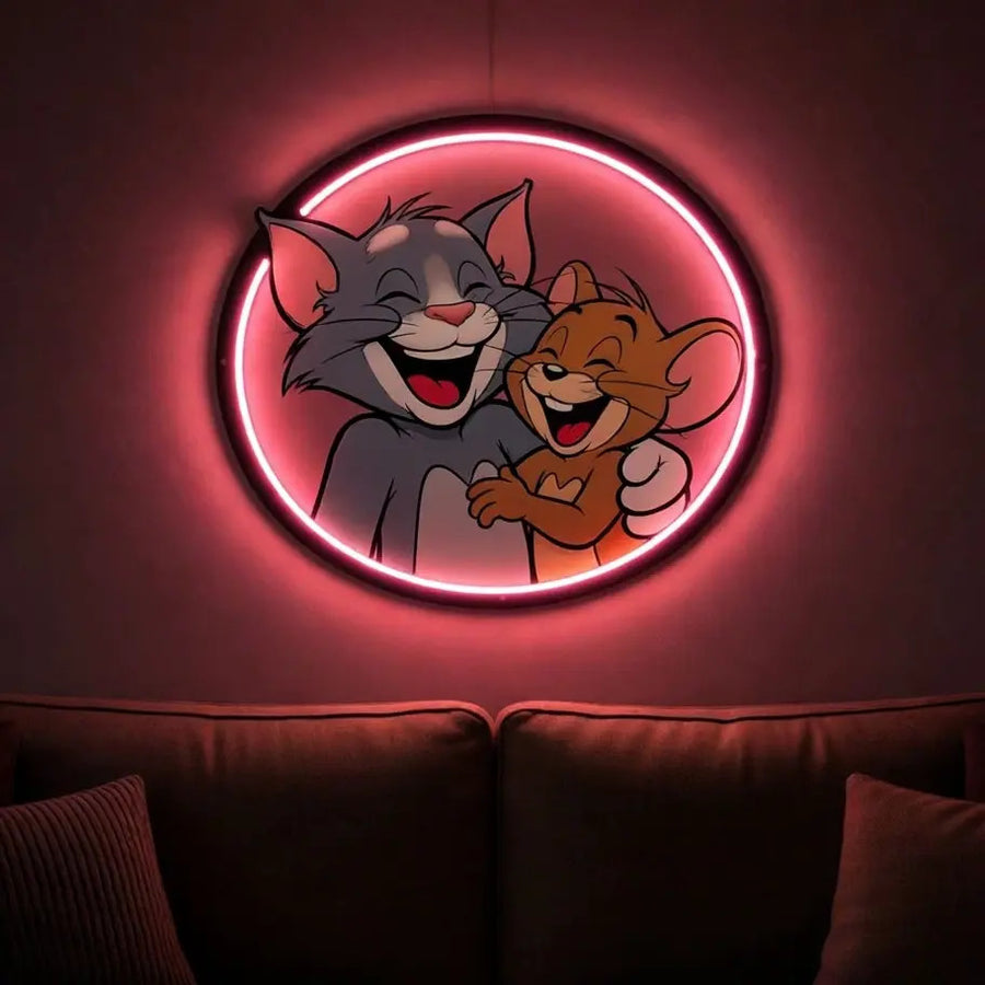 Cartoon cat and mouse laughing UV neon sign with pink LED glow above a sofa